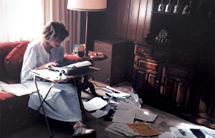 Kristin F. Johnson working on project in high school using an electric typewriter